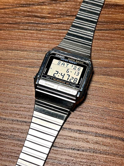 Casio Data Bank DB-310 vintage digital watch with metal band and clear LCD display