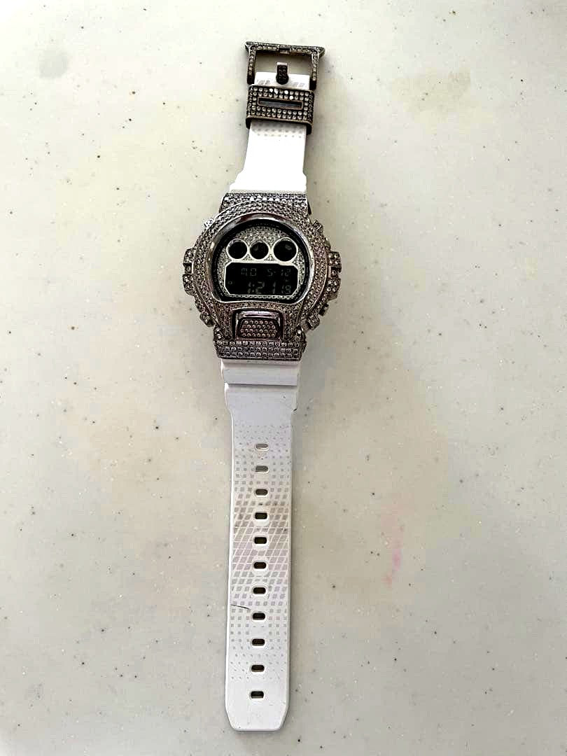Casio G-Shock G-100-1A3DR watch with green resin band and analog-digital display