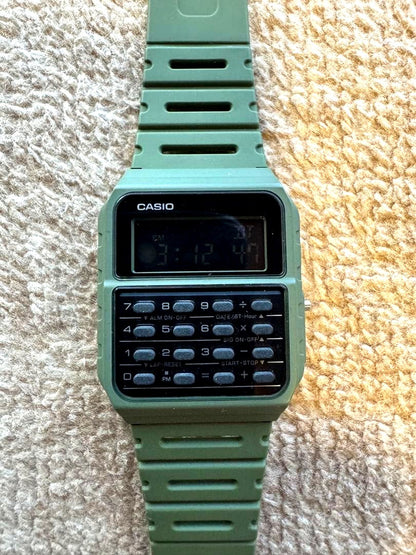 Casio CA-53WF-3B olive green watch with calculator, dual time, and digital display