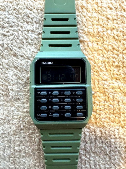 Casio CA-53WF-3B olive green watch with calculator, dual time, and digital display