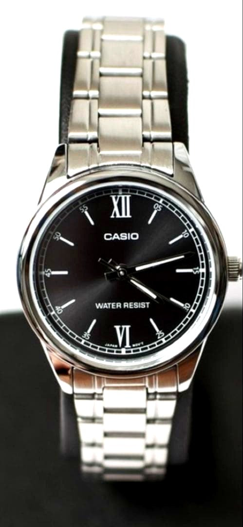 Casio Classic Metal Round Watch with silver band and black dial shown with box and guarantee card