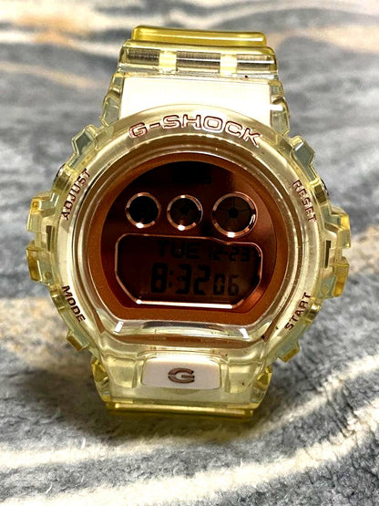 Casio G-Shock GBD-S900SR-7JF digital watch with transparent case and gold digital display