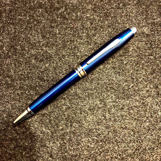 Cross twist ballpoint pen in navy with silver trim shown against white background