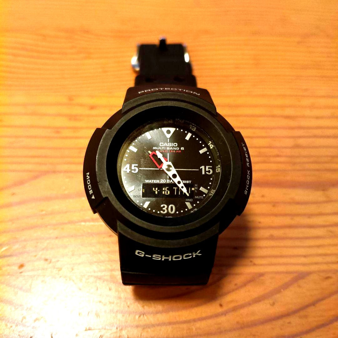 Casio G-Shock AWG-M520-1AJF black watch with rubber band showing digital analog display