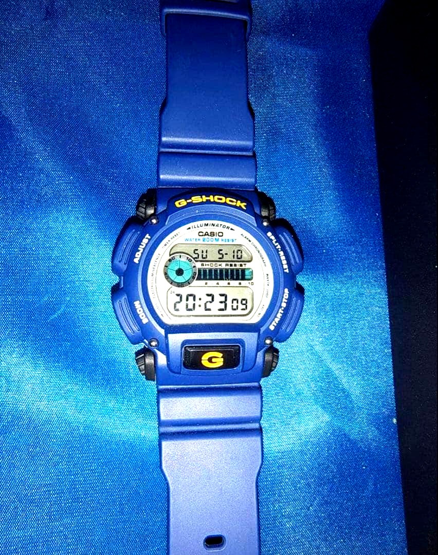 Casio G-Shock DW-9052 navy blue watch with digital display and shock resistant design
