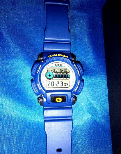 Casio G-Shock DW-9052 navy blue watch with digital display and shock resistant design