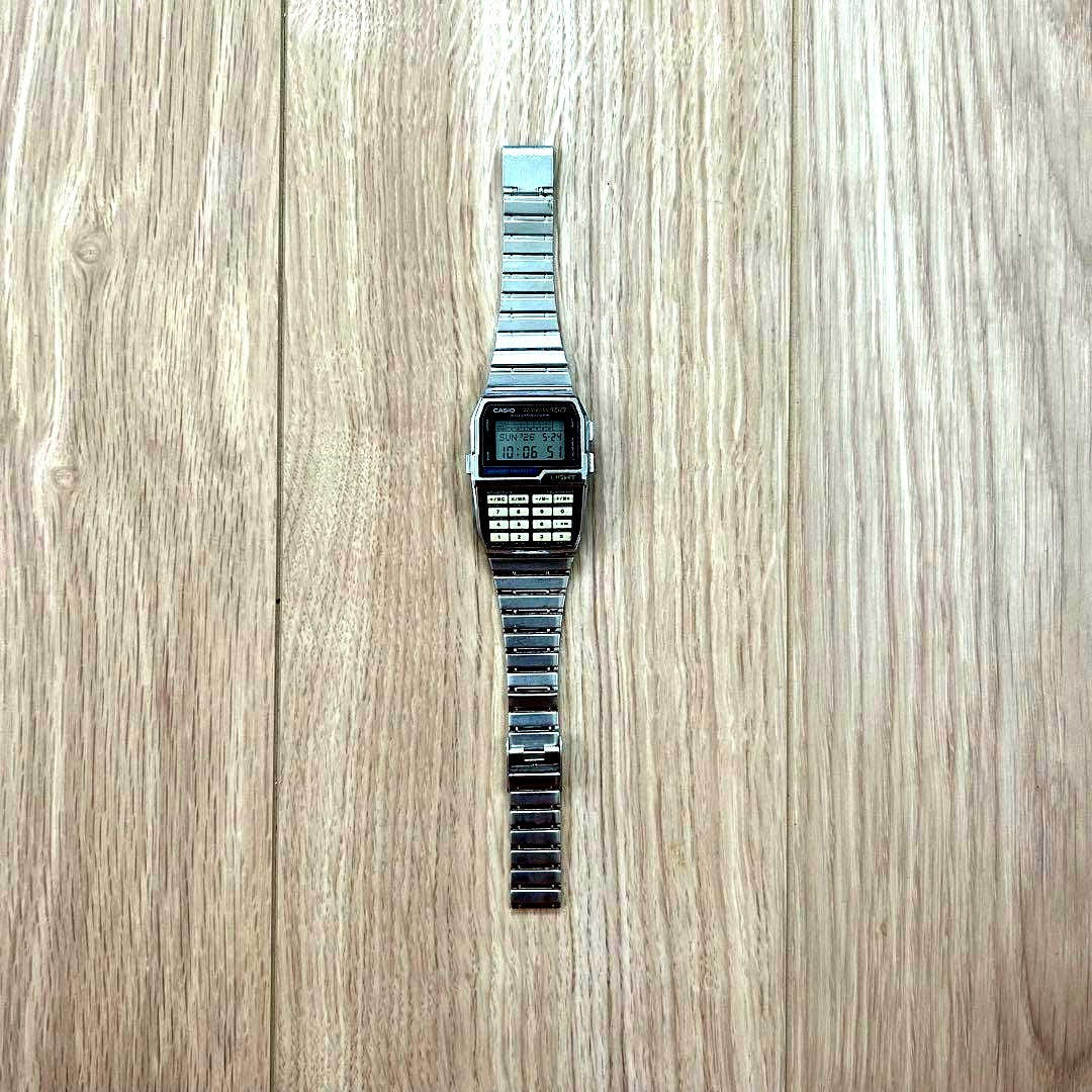 Casio Data Bank DBC-1500 vintage digital watch with calculator and phone memo functions showing keyboard face