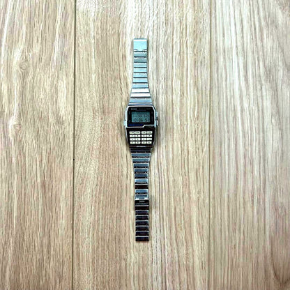Casio Data Bank DBC-1500 vintage digital watch with calculator and phone memo functions showing keyboard face