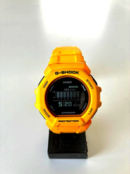 Casio G-Shock GBD-300 yellow sports watch with faded band and bezel, featuring shock and water resistance