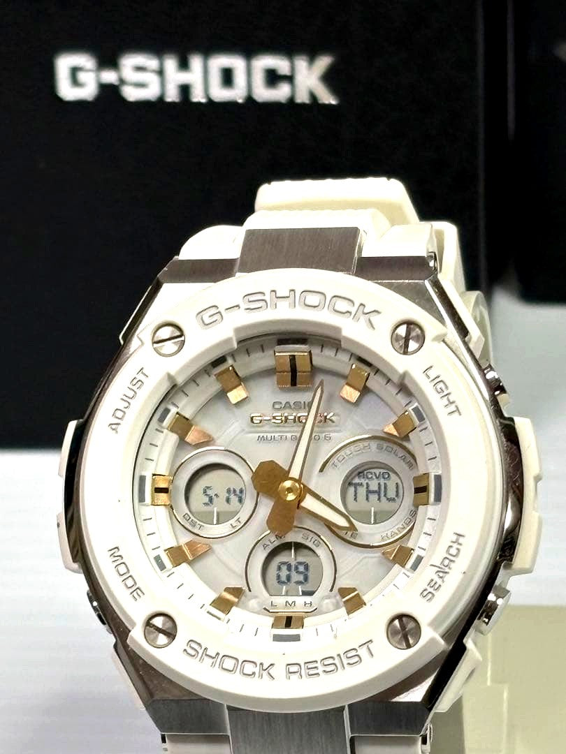 Casio G-Shock G-Steel GST-W300-7AJF watch with white dial, gold hands, and included box
