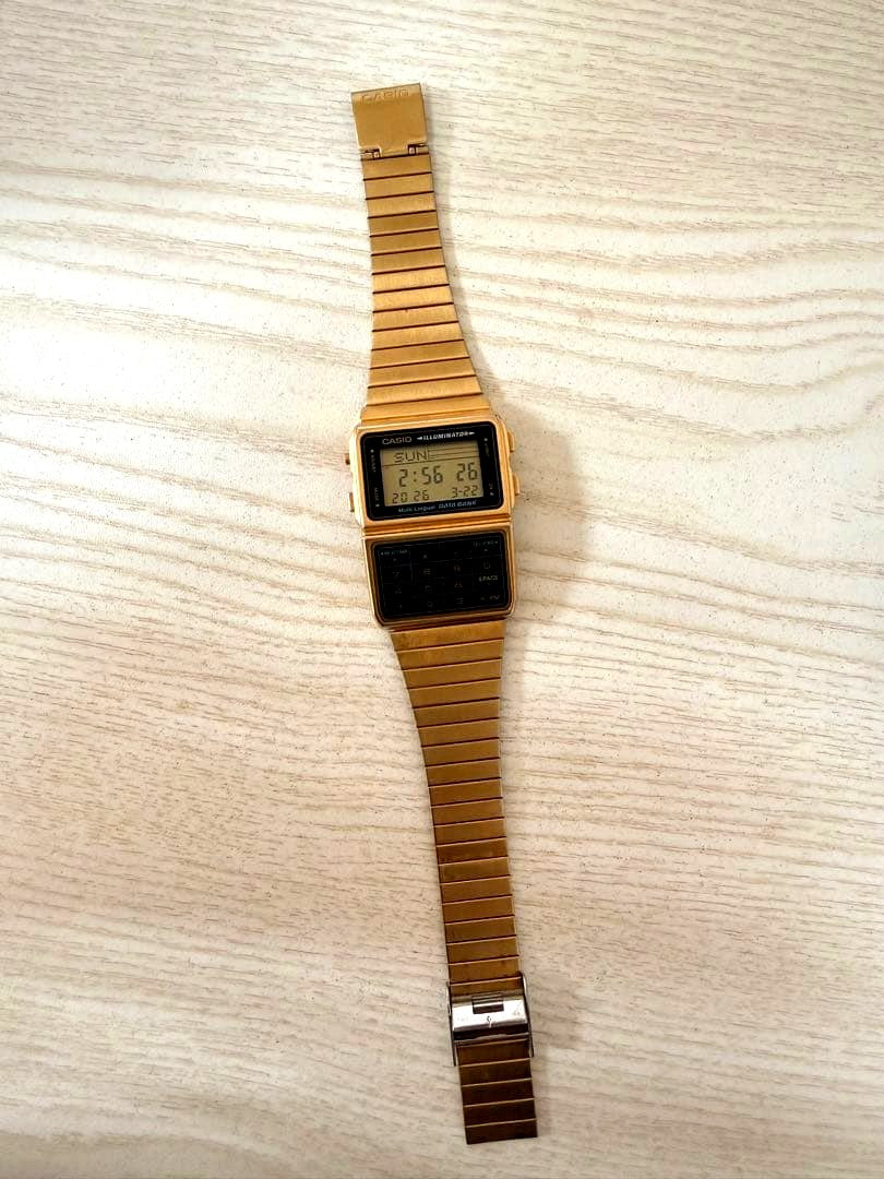 Casio Data Bank DBC-611G digital watch in gold color showing front view with clear display
