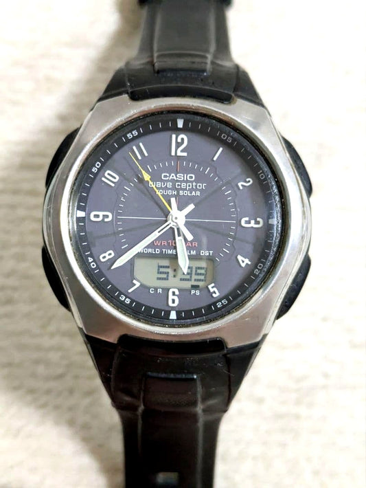 Casio digital watch with solar power, world time display, stainless steel back, and black rubber band