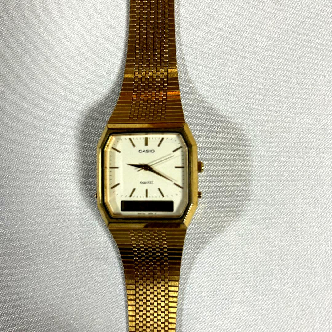 Casio analog quartz wristwatch with gold mesh band showing clear dial and gold finish