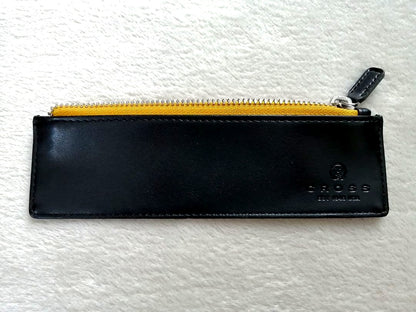 Cross brand leather pen case in used condition with visible scratches and stains