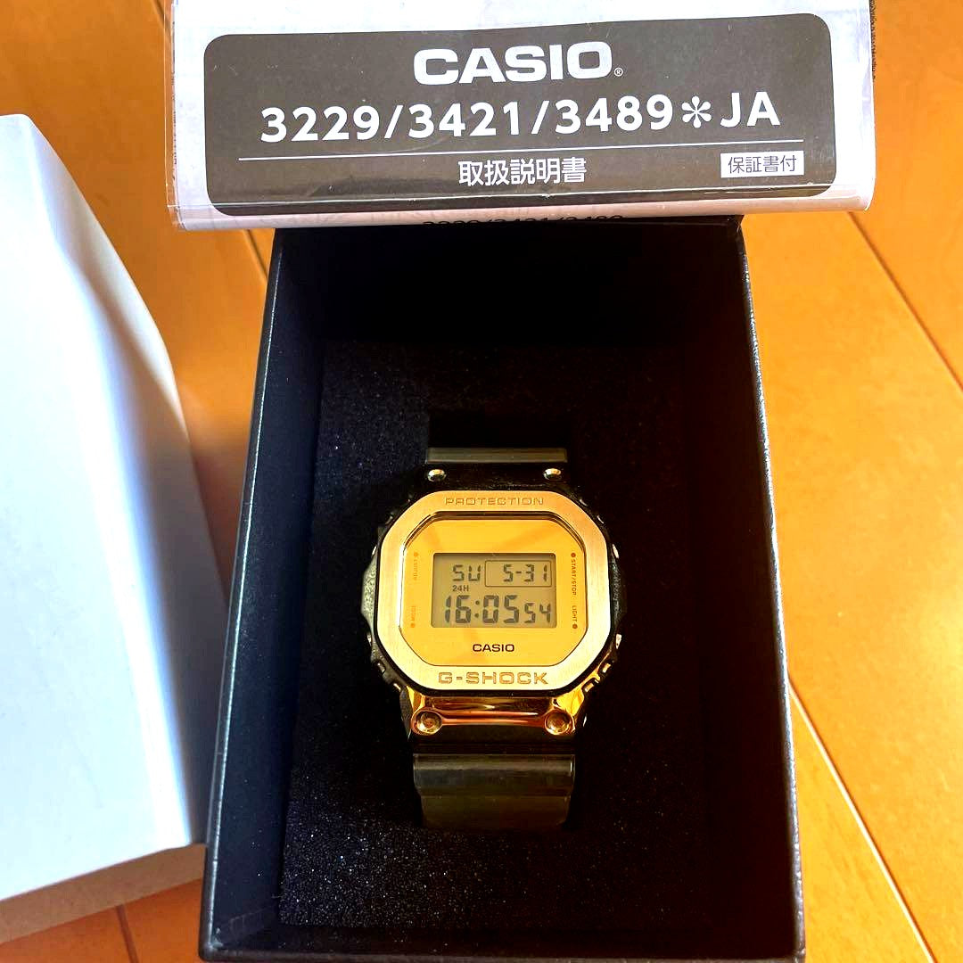Casio G-Shock digital watch in gold skeleton style with clear display and robust design
