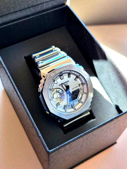 Casio G-Shock GM-2100YM-8AJF silver analog-digital watch with metal bezel and silicone band