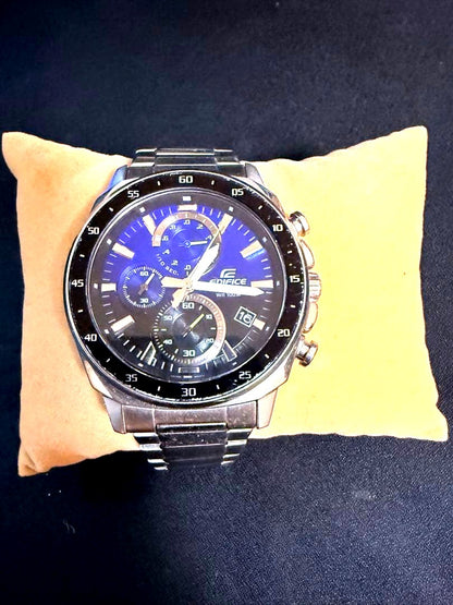 Casio Edifice Chronograph wristwatch with blue dial, stopwatch function, date display, and stainless steel band