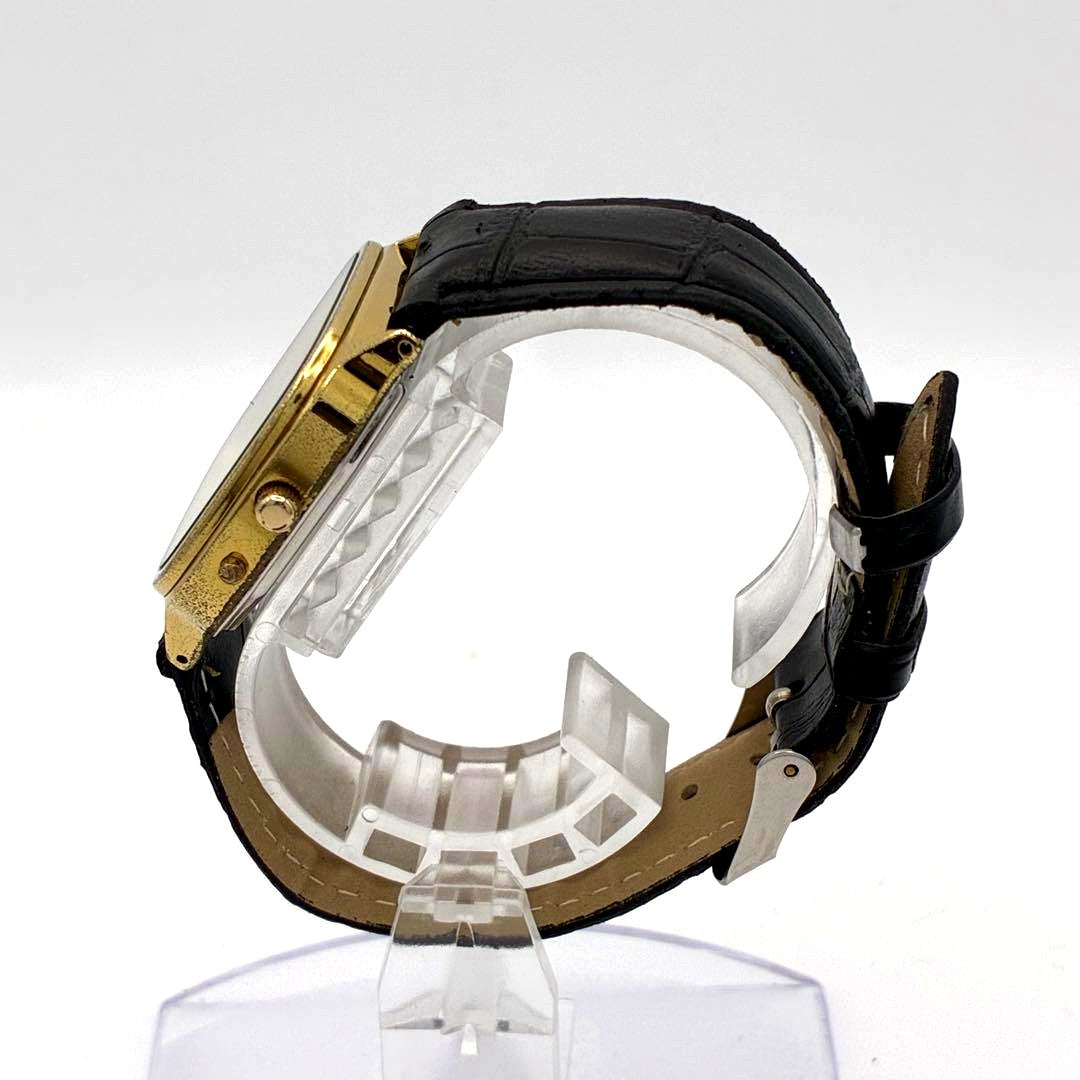 Casio Analog-Digital Wristwatch Model A85 with gold dial and black strap in working condition