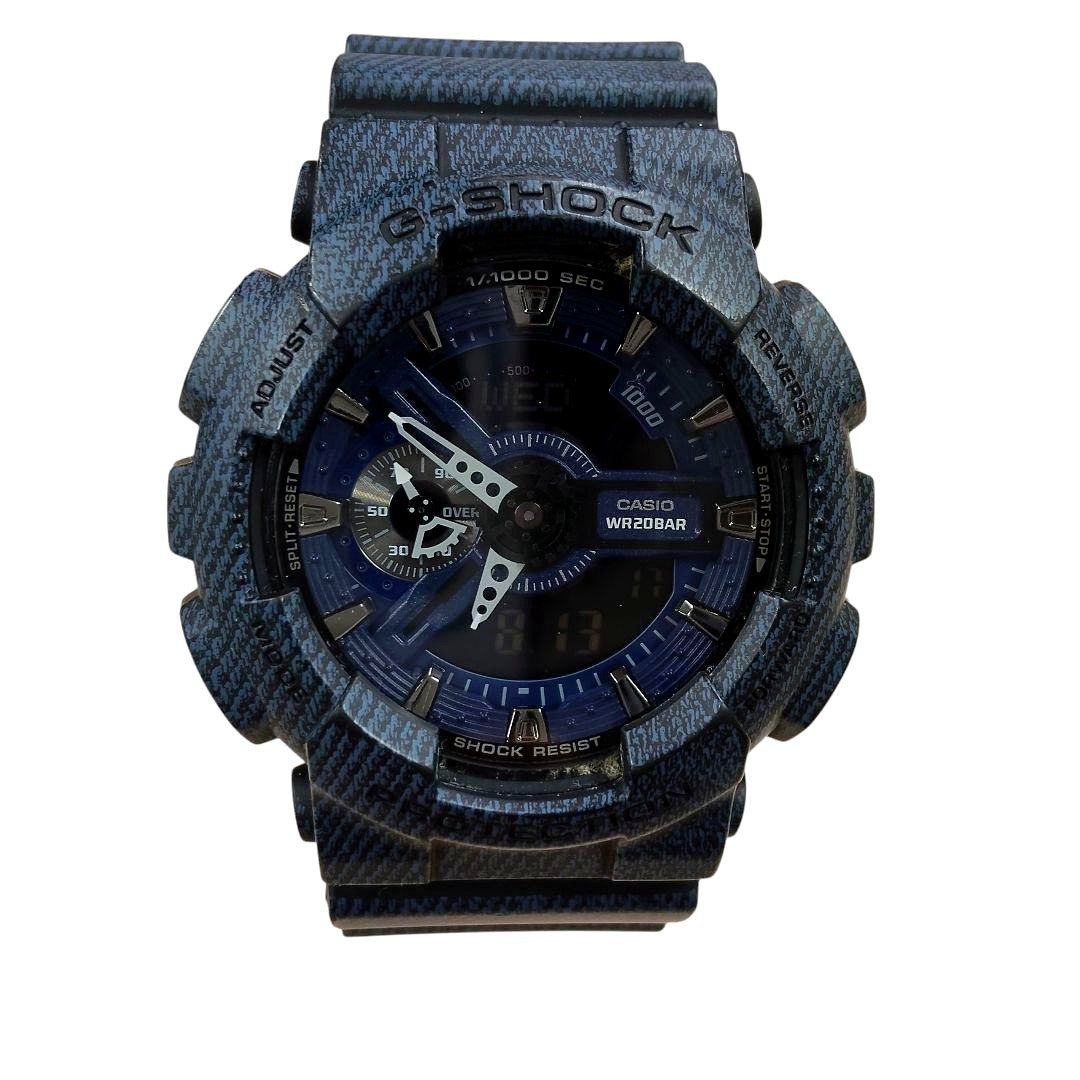 Casio G-Shock GA-110DC watch with denim texture case and band showing dual analog and digital display