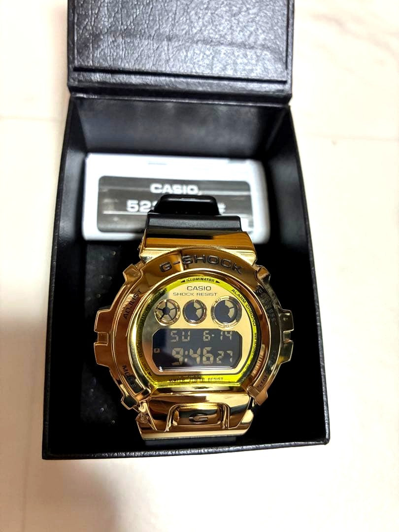 Casio G-Shock DW-5600H-1JF digital watch with gold bezel and black band, Japan import