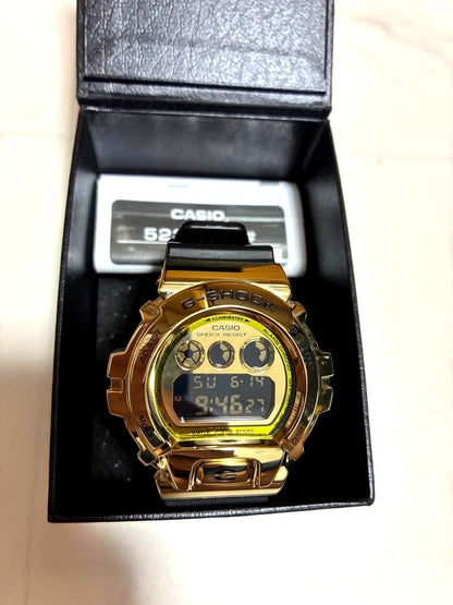 Casio G-Shock DW-5600H-1JF digital watch with gold bezel and black band, Japan import