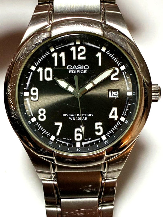 Casio Edifice quartz wristwatch for men with black dial and adjustable date crown, Japan import