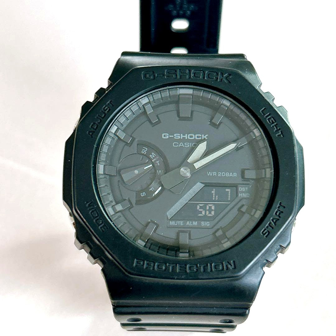 Casio G-Shock GA-2100 watch with visible scratches on glass and worn band Japan import