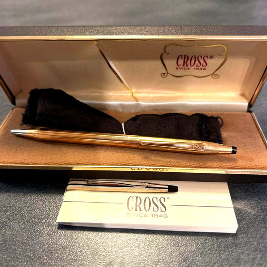 Cross gold ballpoint pen displayed with its special matching gold case