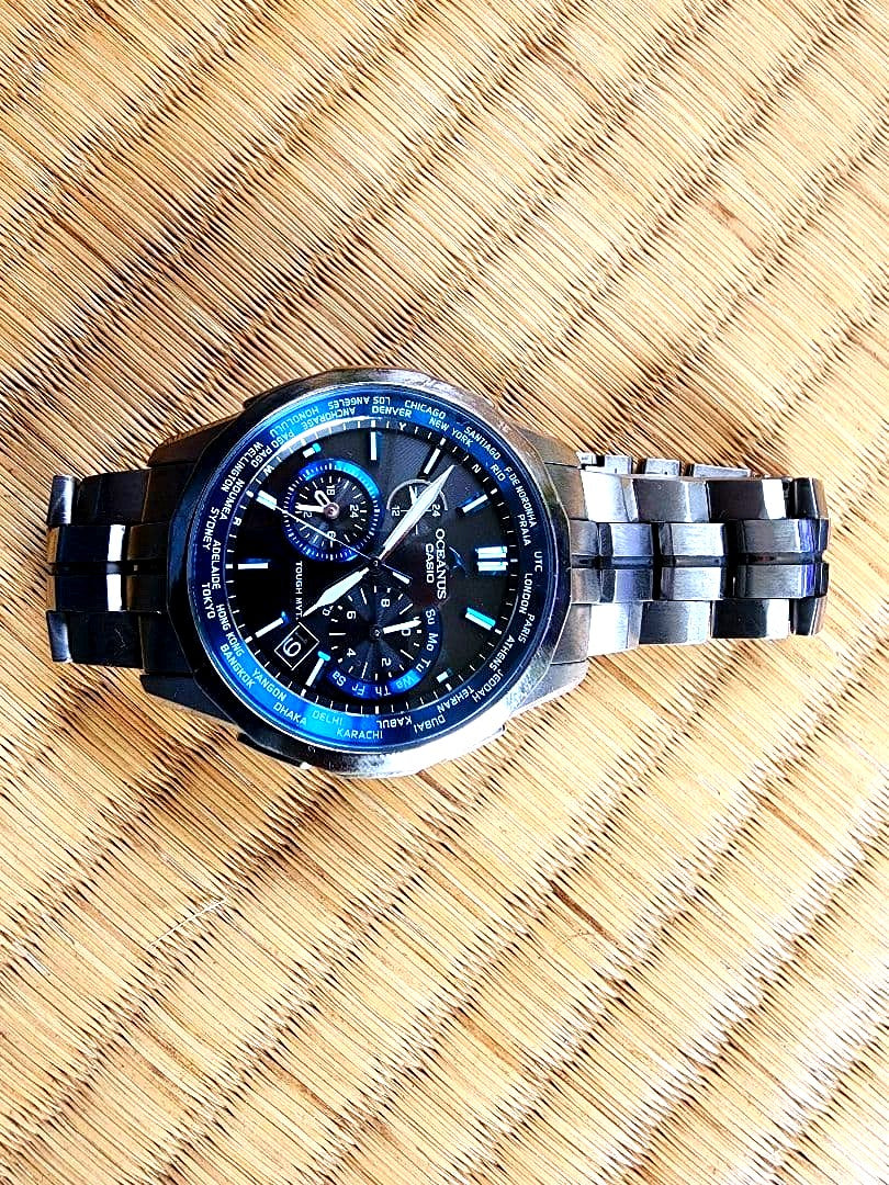 Casio Oceanus OCW-S1400-1AJF radio controlled watch with black dial, blue accents, and titanium band