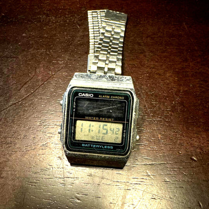 Casio AL-180 vintage digital watch from 1987 with stainless steel band and solar charging feature