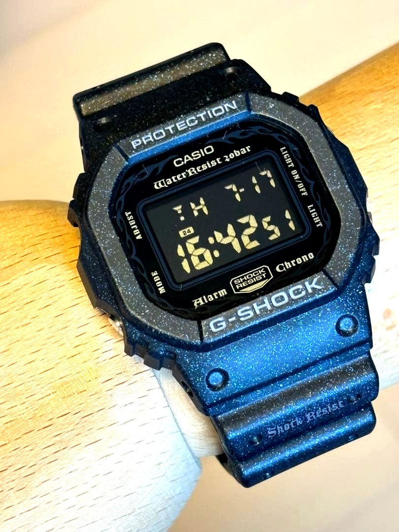Casio G-Shock DW-5600GM vintage digital watch in metallic gunmetal with inverted LCD display