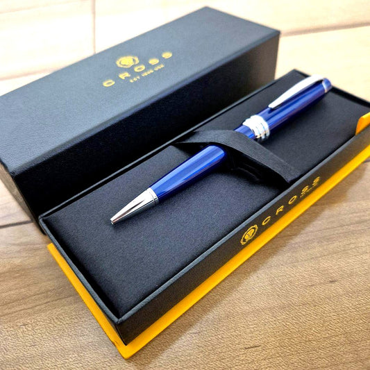 Cross Bailey Twist Ballpoint Pen in blue with brass body, glossy finish, displayed with genuine case and box