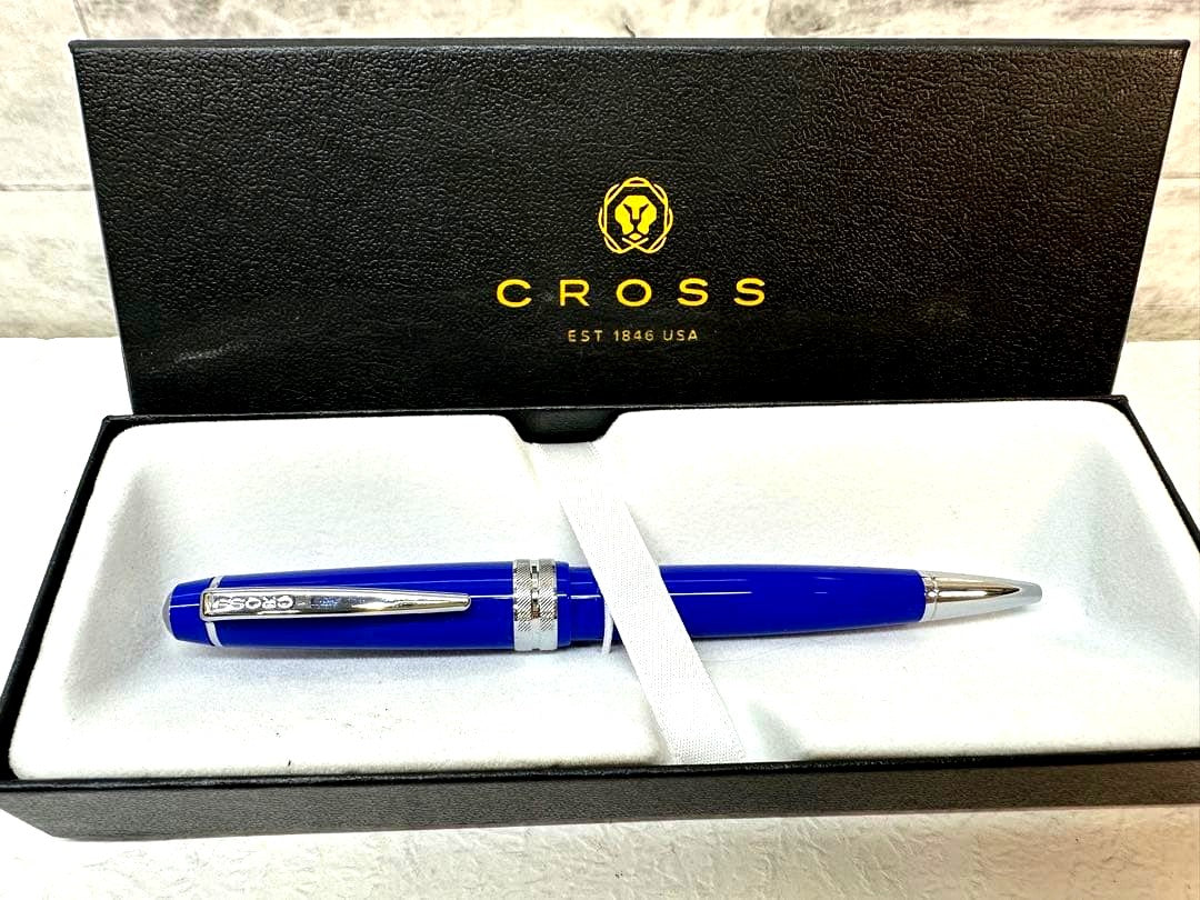 Used CROSS ballpoint pen with blue body, silver accents, and dedicated case