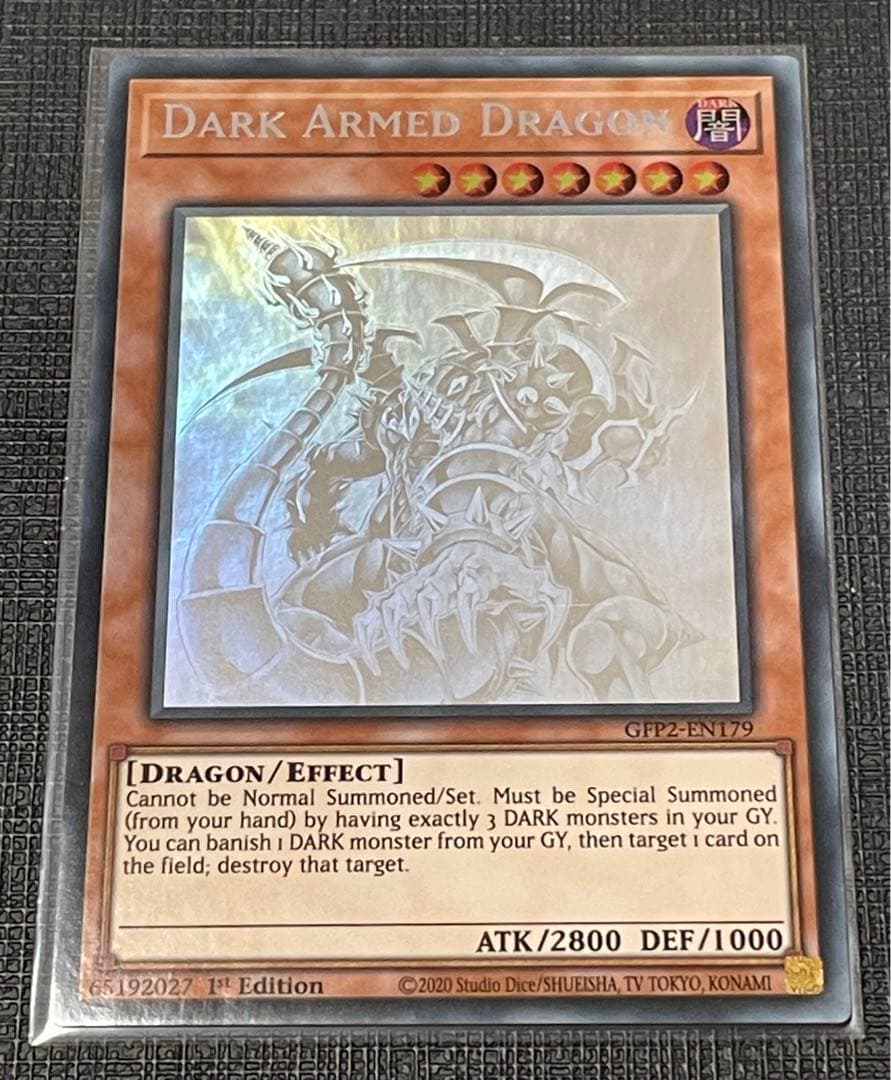 Sony Dark Armed Dragon Ghost Rare Yu-Gi-Oh trading card with visible overseas scratch marks