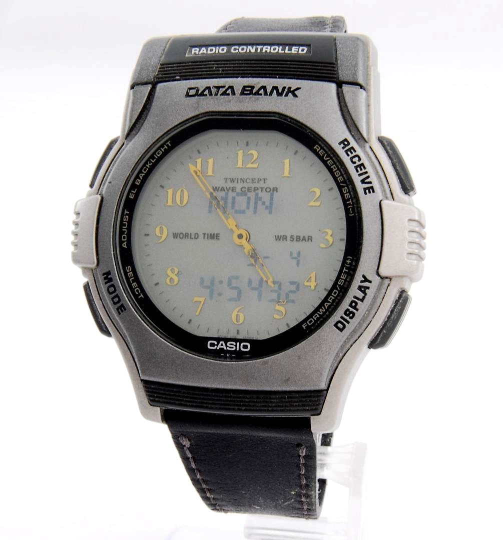 Casio Data Bank Twincept FKT-2000 silver radio-controlled watch with analog and digital display on a leather strap