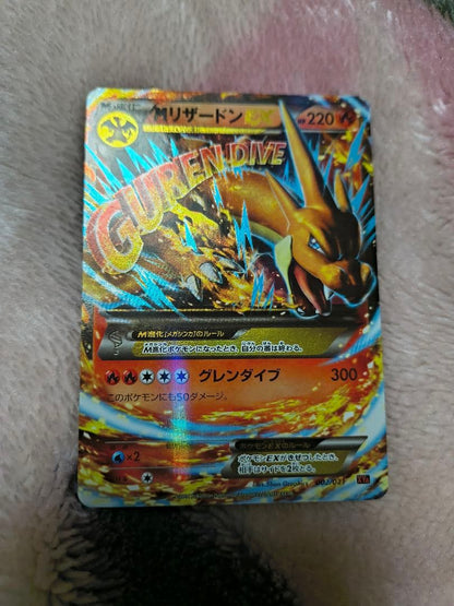 Mega Charizard Y Pokemon trading card sleeved for protection, authentic Japan import