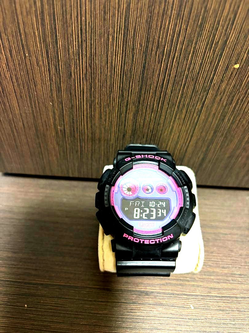 Casio G-Shock digital watch in black and purple with illuminator and 200 meter water resistance
