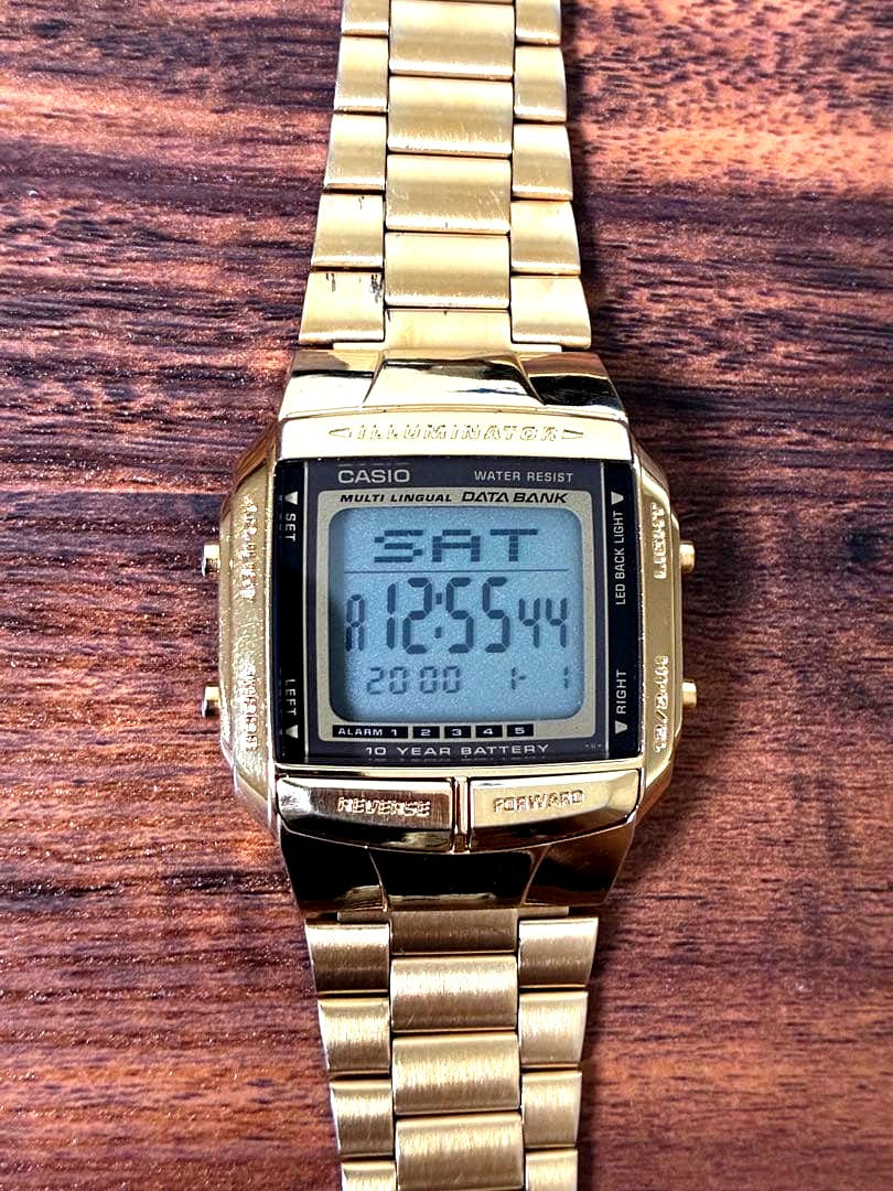 Casio Data Bank DB-360G gold digital watch with dual time display and stainless steel band