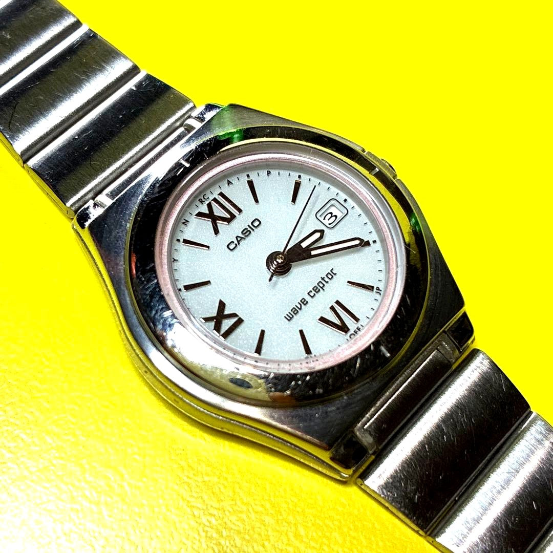 Casio Wave Ceptor radio solar ladies watch with white dial and Roman numeral indices
