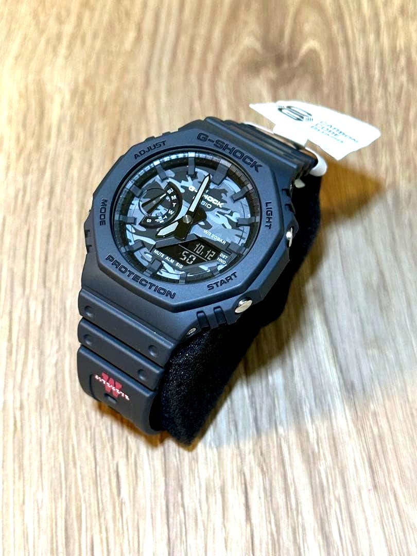 Casio G-Shock GA-2100 digital watch with Waseda Jitsugyo School logo on the band in like-new condition
