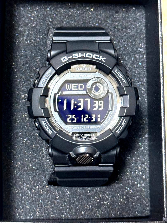 Black Casio G-Shock digital watch with step tracker and 200 meters water resistance