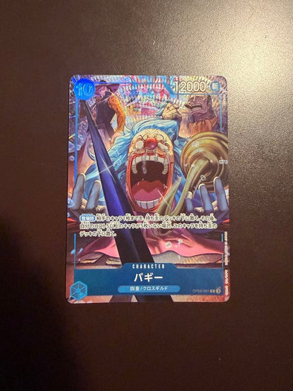 One Piece Buggy Character Card OP09-051 in protective sleeve with no visible scratches or stains
