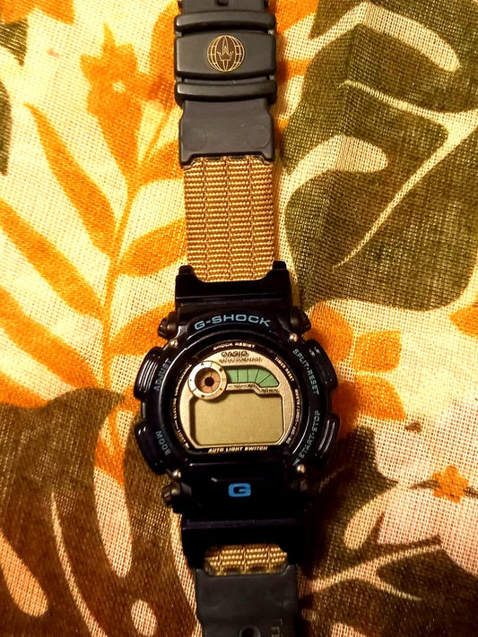 Casio G-Shock DW-9000 1997 vintage watch with black strap, shown from front angle
