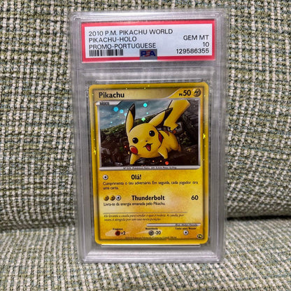 Pikachu World Portugal PSA10 Pokémon card promo box with graded cards including Pikachu and Charizard