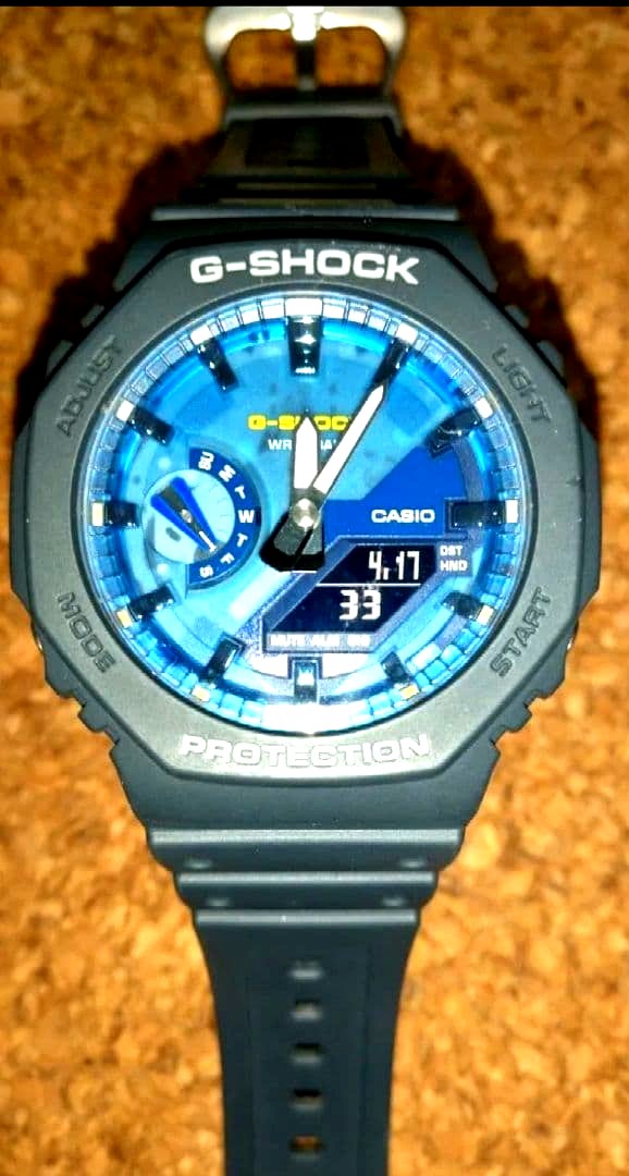 Casio G-Shock GA-2100AS-2AJF watch with blue dial and octagon case, showing analog-digital display