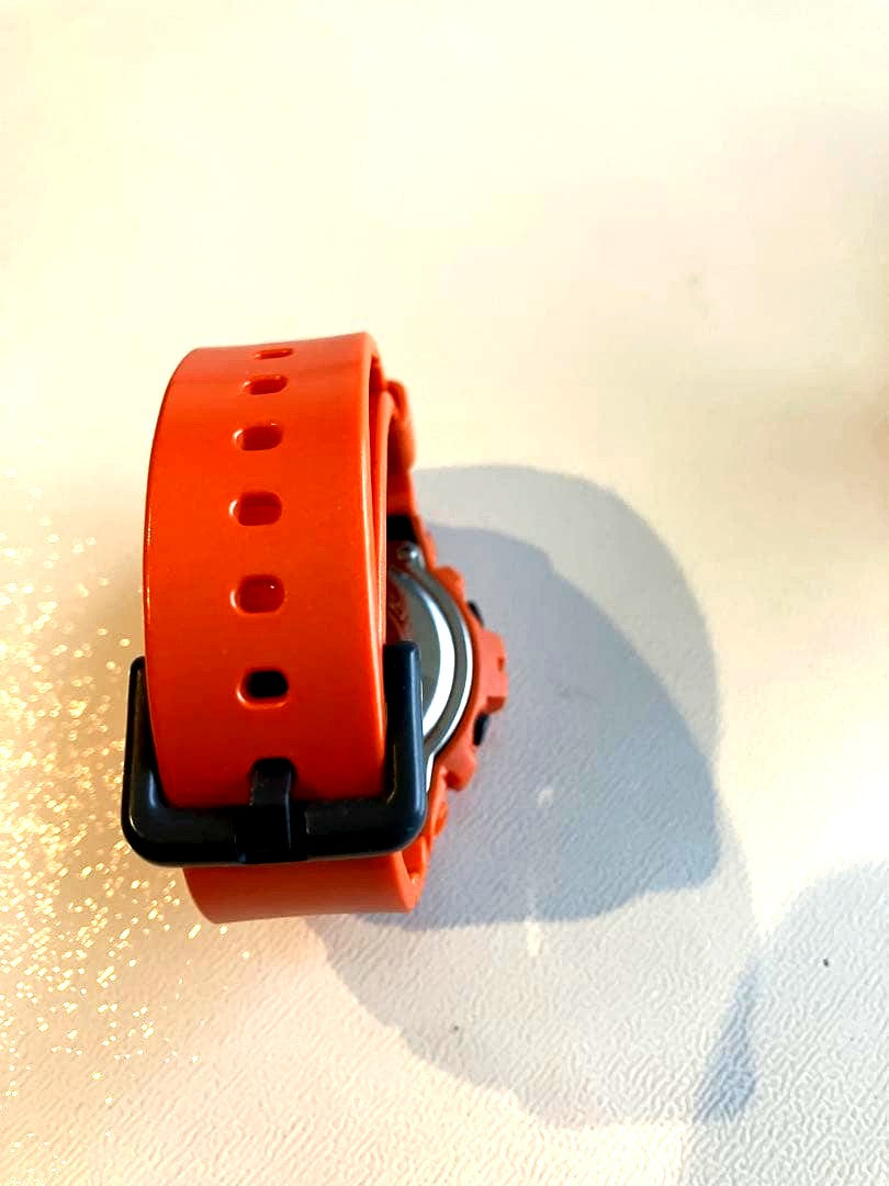 Casio G-Shock orange digital wristwatch with shock resistance and water resistance up to 200 meters