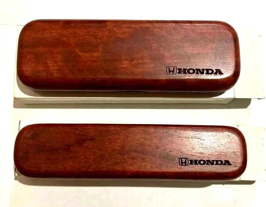 Honda Novelty Wooden Case Ballpoint Pen by Cross showing aged wooden case and two pens with signs of wear