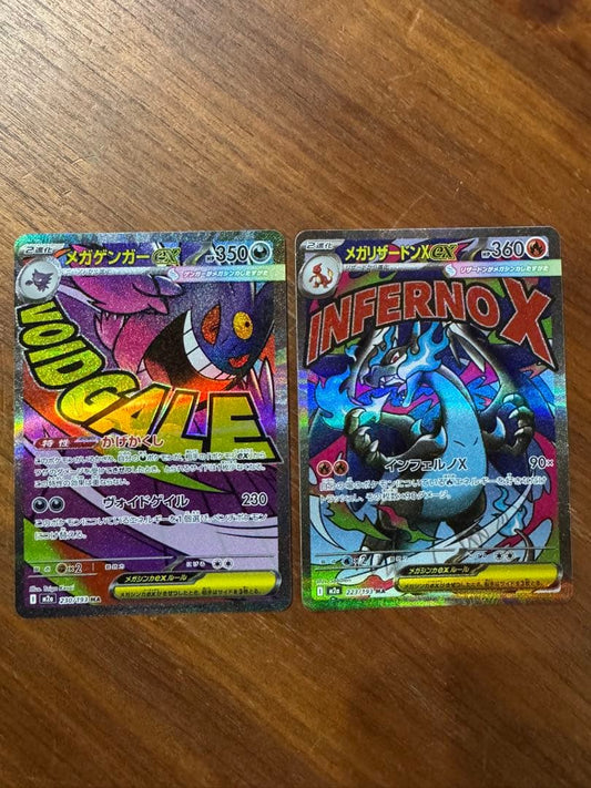 Pokemon card set featuring Mega Charizard X ex MA and Mega Gengar ex MA cards in protective sleeves