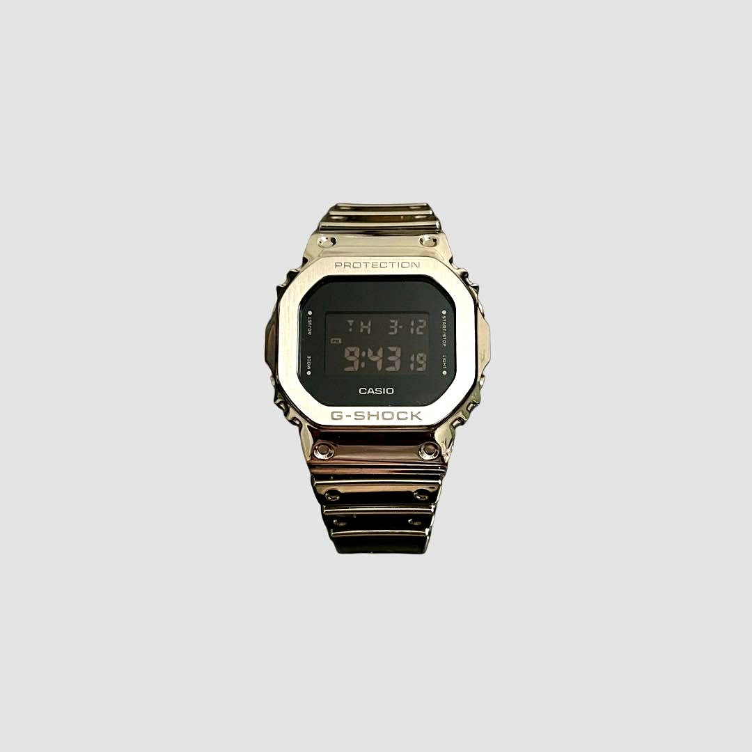 Casio G-Shock GM-5600YM-8J silver digital watch with square face and robust design
