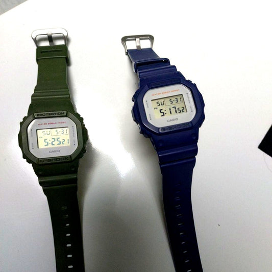 Casio G-Shock DW-5600M two-piece digital watch set with shock-resistant square design and black bands